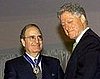 Mitchell receives the Presidential Medal of Freedom for his work to bring peace to Northern Ireland. 