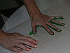 Put Painted Hand to Paper