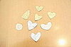I found small pieces of silver and gold leather in the remnants at a fabric store. Cut out shapes and tape them on to the cake.