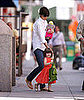 Suri Flashes a Smile For the Paps
