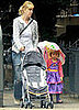 A Wee Matilda Keeps Dry in Her Princess Dress