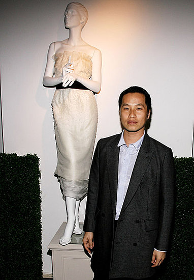 Designer Philip Lim poses by his wedding dress 