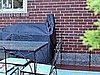 The painted & repurposed record rack intended to provide service to the grill.