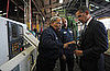 Barack Obama picks up a bolt during a tour of the Cardinal Fastener & Specialty Company factory.