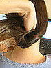 Lift ponytail up and over ponytail holder, right into the hole you created. Push all the way through.