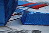 Once the airplane wings have dried, create a 1-2 inch flap, but folding the end without the racing stripes.