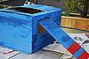 Attach the wing to the body of the plane by taping, or stapling, the folded portion of the wing inside the arm-holes.