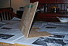 Use another spare piece of cardboard to create a windshield.  The piece of cardboard should be the same width as the body of the