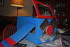 Staple the propeller to the front of the plane.