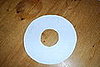 Next, cut a large circle out of a sheet of poster board or construction paper.  Cut a smaller hole out of the center.