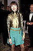 Nov. 1991: Sheer gold at a holiday benefit, with then-husband David Shaffer fading into the background.