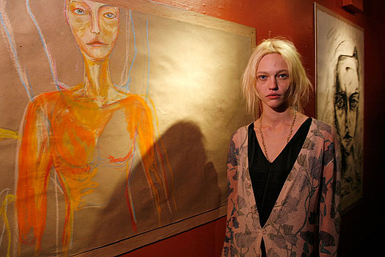 Feb 8: With her artwork at her "I Spy" exhibition.
