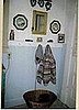 I made the shelf and peg rail to top the paneling. The little coat is my bare nekkid dog, Hero's.