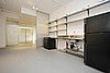 As you can see, it was a drab kitchen with a basic electric stove, painted white and with cold galvanized steel shelves.
