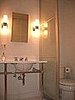 We put in a partition between the toilet and the rest of the bathroom. It offers privacy and a clean modern airy feel.