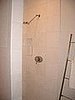 This is our Thassos White marble shower. The rainhead showerhead feels very spa. We put in carrara tile on the shower floor.