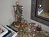 my perfume and necklace collections on the vanity...