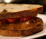 Grilled Gourmet Sausage Sandwich on Olive Bread