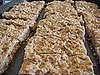 Cutting the baked cookies into bars. 