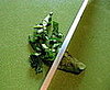 Rock a sharp knife back and forth across the "roll," creating consistently thin slices. 