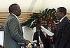 Zimbabwe's opposition leader Morgan Tsvangirai, head of the Movement for Democratic Change (MDC), is sworn in by President Rober