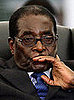 Zimbabwean President Robert Mugabe attends the swearing in ceremony of new Prime Minister Morgan Tsvangirai.