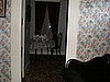 Living room looking into the dining room. That sofa on the right is where the body of Andrew Borden was found (Lizzie "found" it