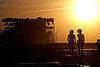 Two girls walk toward the building of the US Interests Section