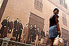 A Cuban girl walks in front of an old restored high school in Habana Vieja 