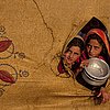 Displaced: Pakistani Girls Await Their Meals in Refugee Camp