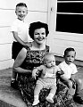 my lovley Grandma and 3 (out of 5) of her babies. The little man with boobs is my dad :)