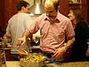Making the cornbread andoiulle stuffing.