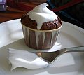 Miniature Molten Chocolate cake topped with fresh whipped cream