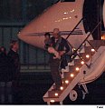 Brad carring Pax as they land in Prague.