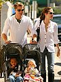 Brad, Angie, Zahara, and Shiloh talking a walk in the street of New Orleans.