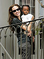Angie and Zahara watching Mardis Gras from their balcony.