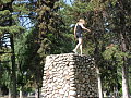 Climbin a fire pit rock thing.