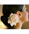 i love flowers in the hair . i think it looks very flamanco dancer like .
