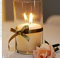 These candles are very pretty , especially with the single pink rose . I love the ribbon as well .