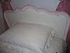Scalloped headboard is perfect to add the pink paint trim to match the quilts.